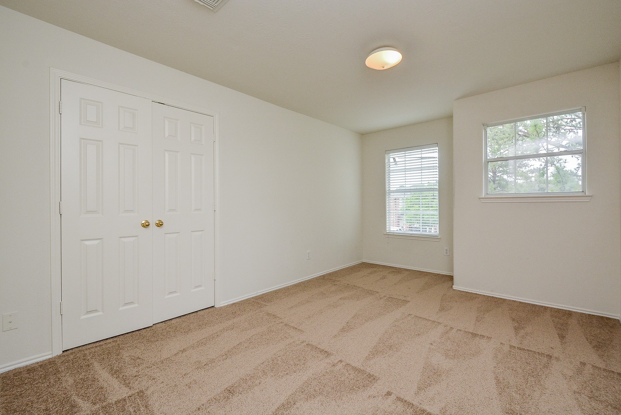 18326 Thicket Grove Road Houston, TX 77084 - Photo 36 of 50 an empty room with windows