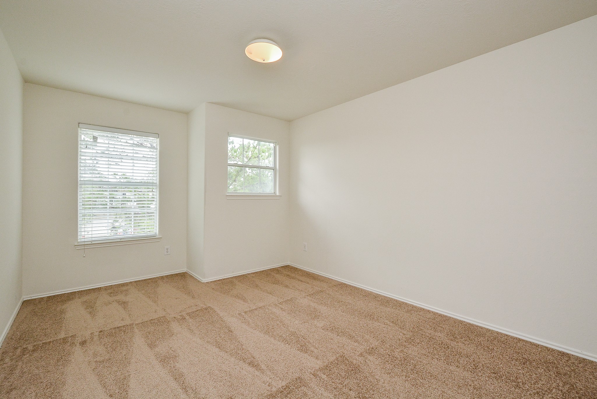 18326 Thicket Grove Road Houston, TX 77084 - Photo 37 of 50 an empty room with a window