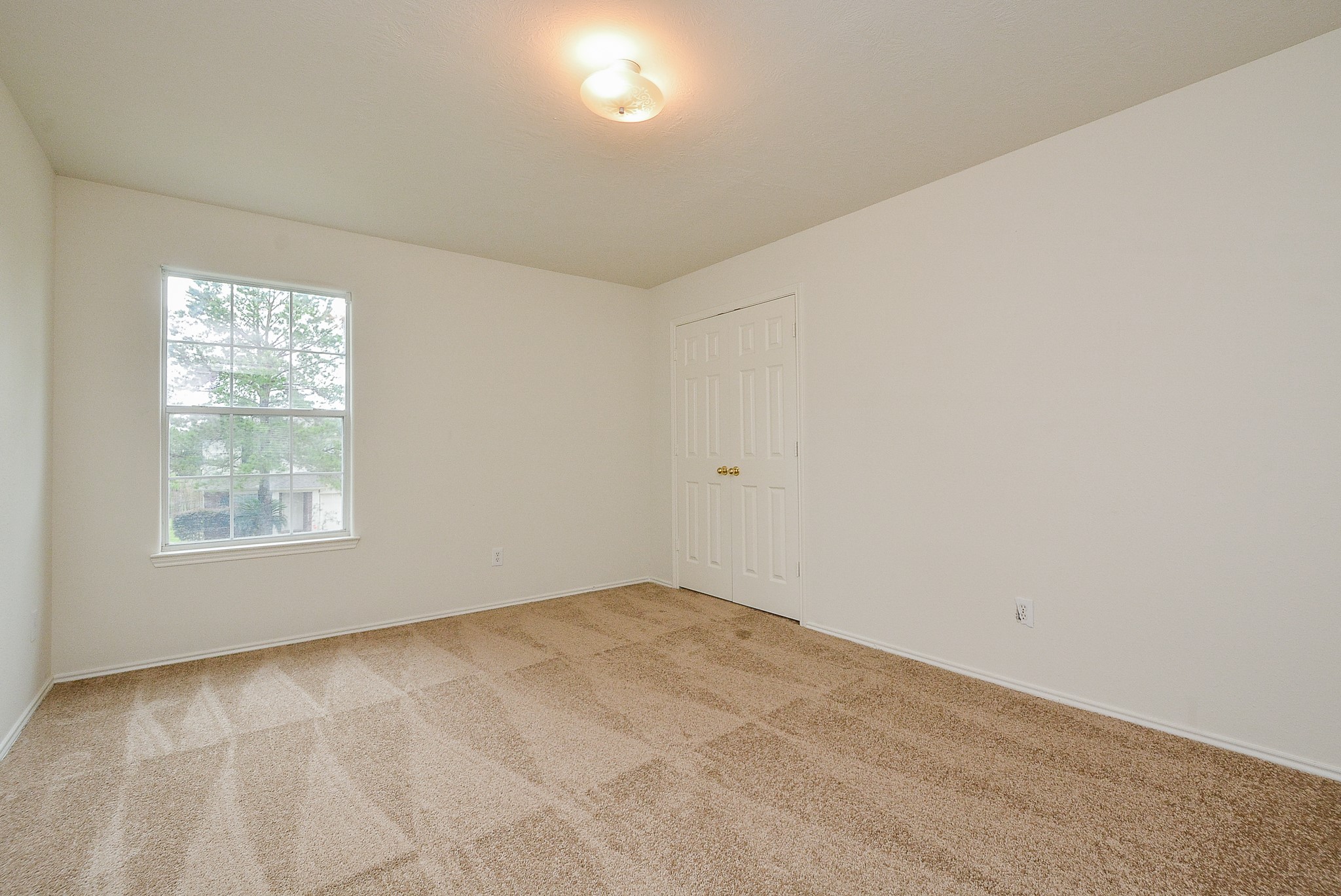 18326 Thicket Grove Road Houston, TX 77084 - Photo 40 of 50 an empty room with a window