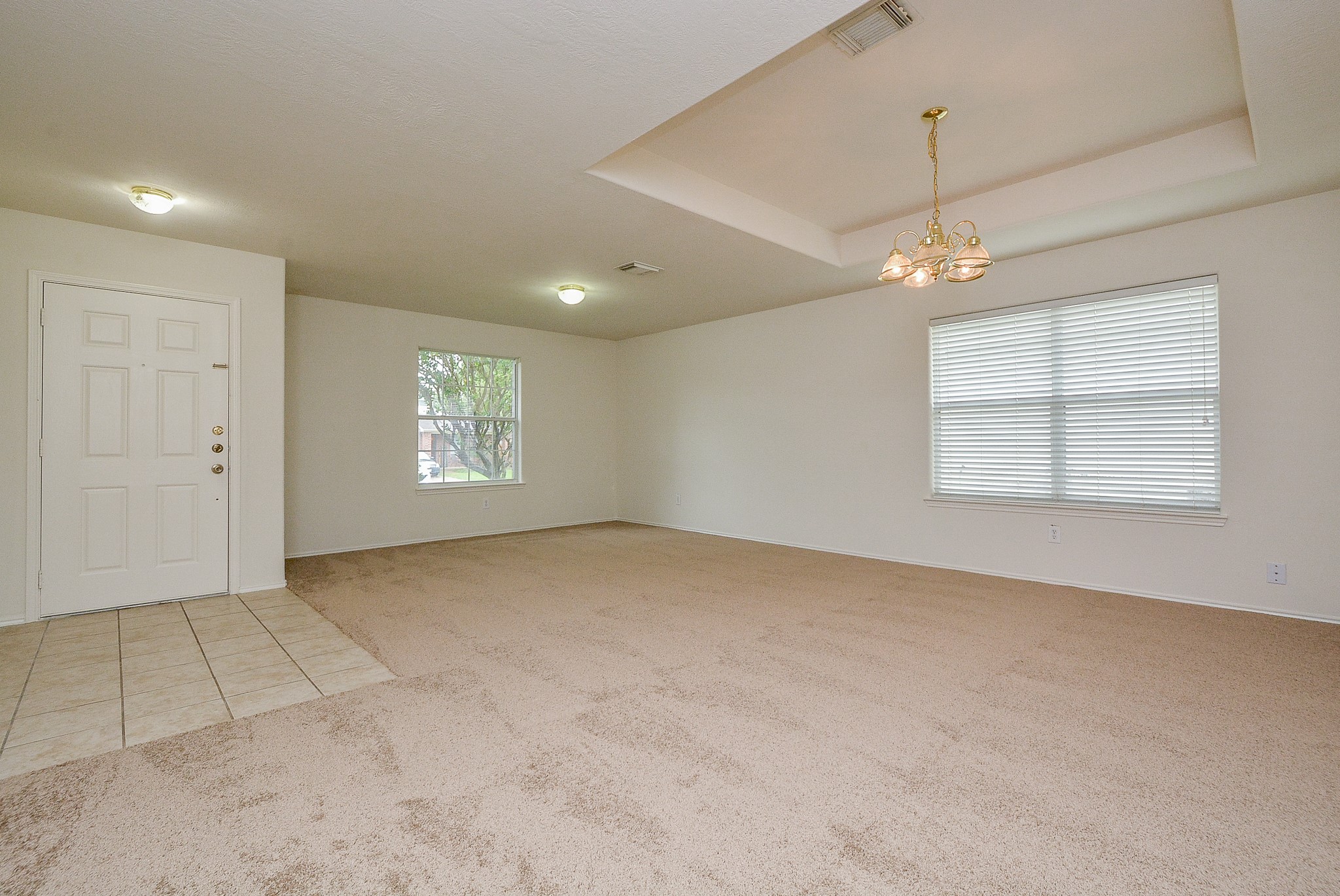 18326 Thicket Grove Road Houston, TX 77084 - Photo 4 of 50 an empty room with windows and fan