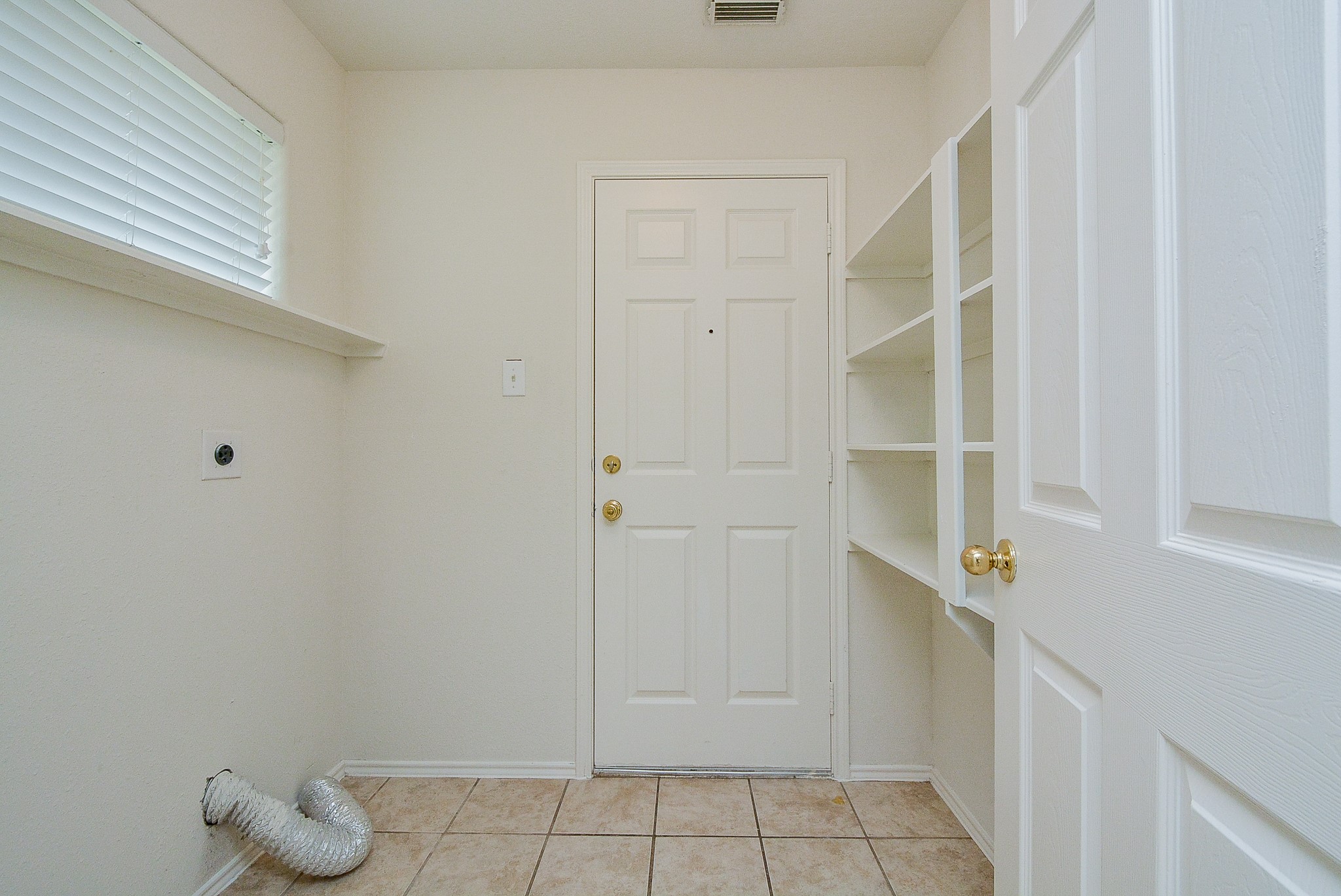 18326 Thicket Grove Road Houston, TX 77084 - Photo 43 of 50 a view of small space with racks on the wall