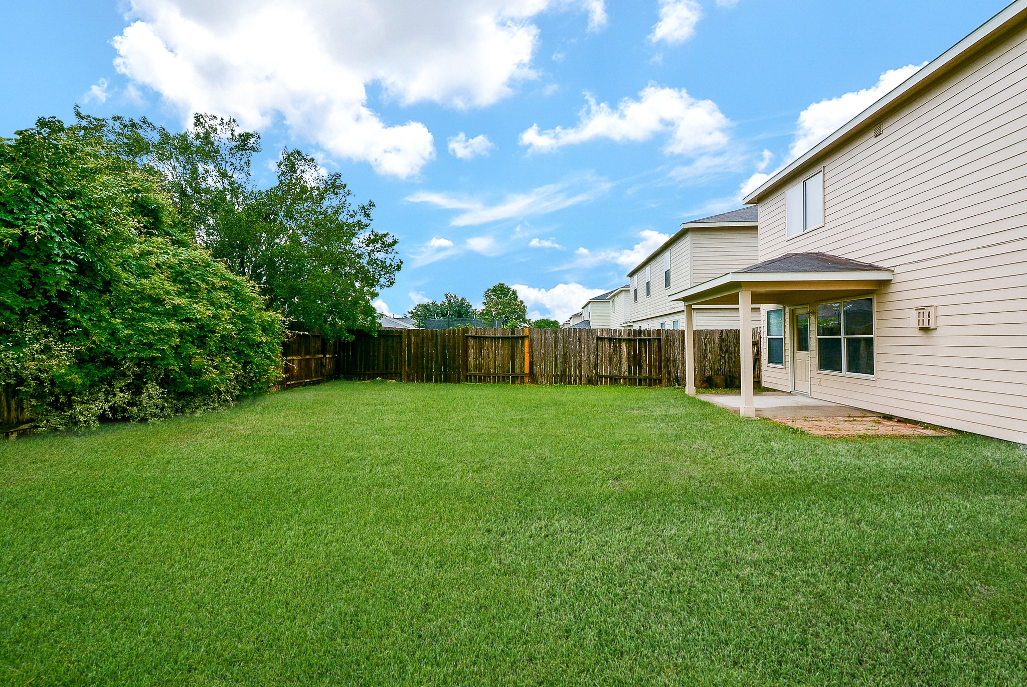 18326 Thicket Grove Road Houston, TX 77084 - Photo 48 of 50 a view of a house with a backyard