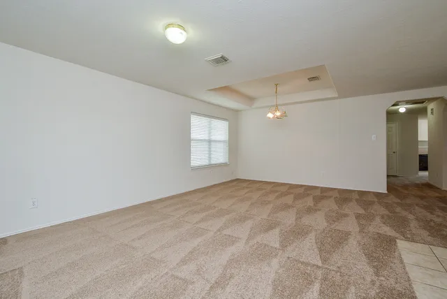 a view of an empty room and window
