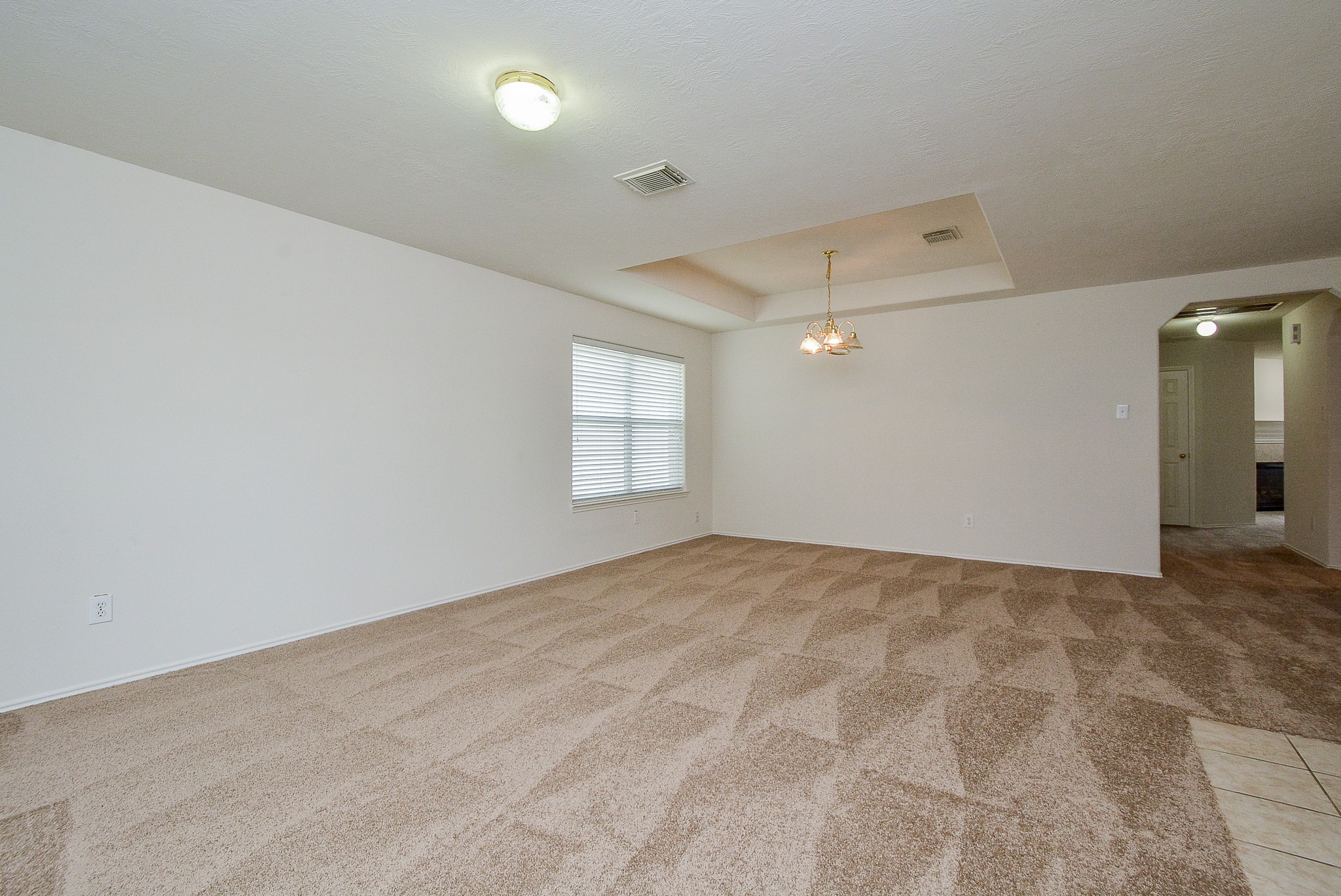 18326 Thicket Grove Road Houston, TX 77084 - Photo 6 of 50 a view of an empty room and window