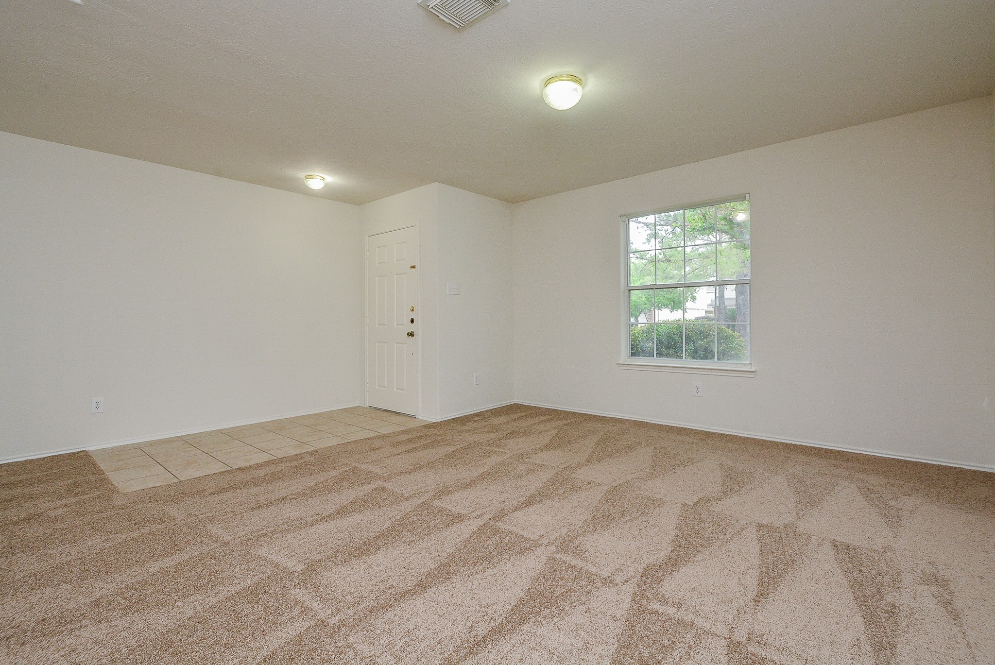 18326 Thicket Grove Road Houston, TX 77084 - Photo 8 of 50 an empty room with a window