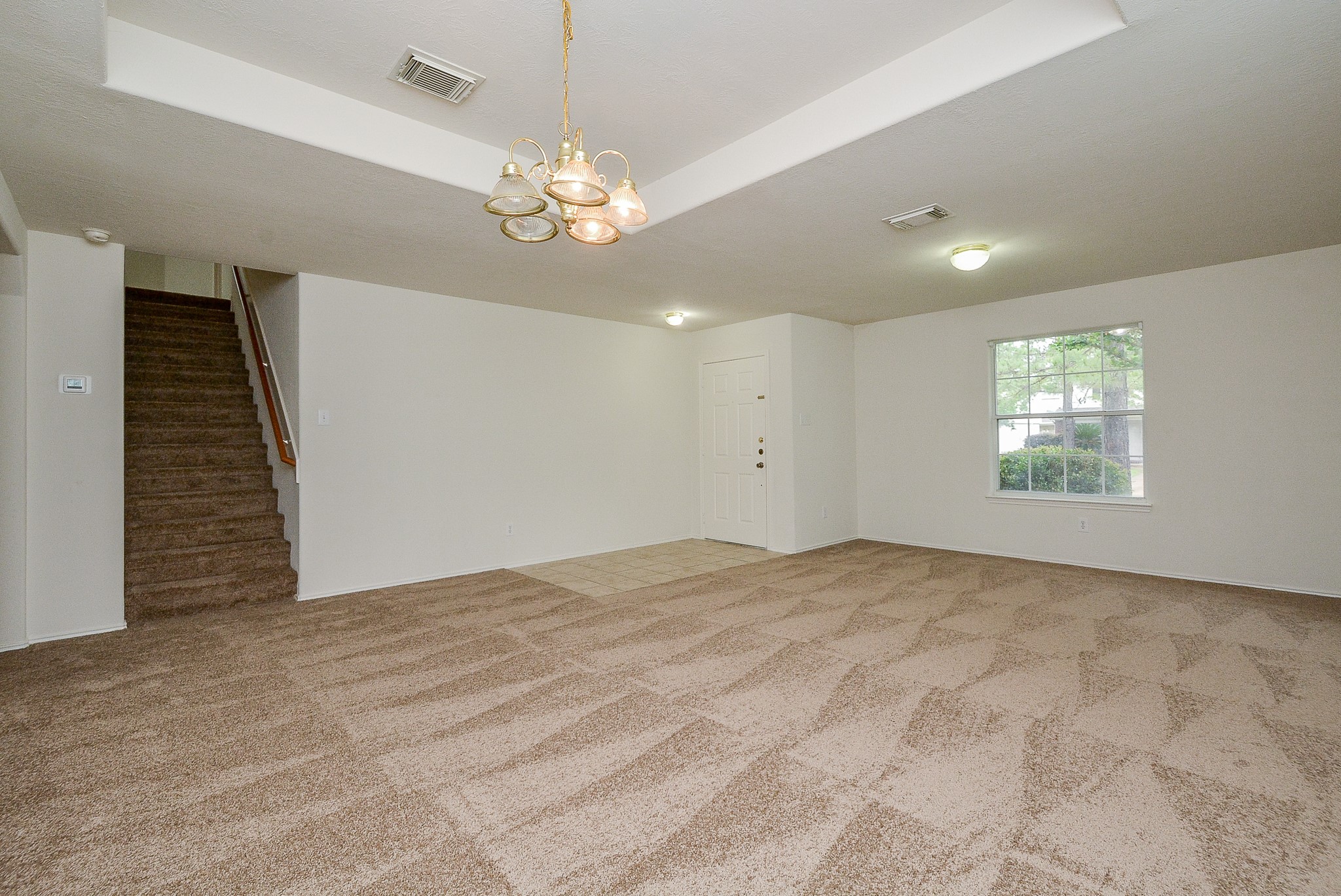 18326 Thicket Grove Road Houston, TX 77084 - Photo 9 of 50 a view of an empty room with a window