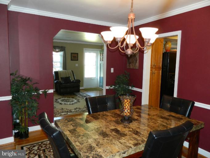 67 Garden Ridge Road Baltimore, MD 21228 - Photo 1 of 26 a view of a dining room with furniture