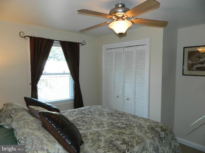67 Garden Ridge Road Baltimore, MD 21228 - Photo 12 of 26 a bedroom with a bed and a window