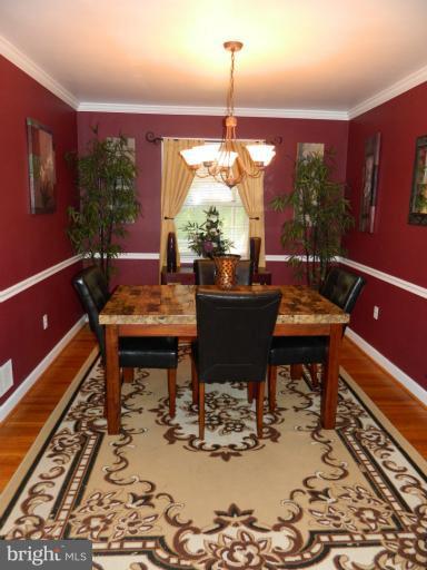 67 Garden Ridge Road Baltimore, MD 21228 - Photo 14 of 26 a outdoor dining space with furniture