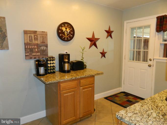67 Garden Ridge Road Baltimore, MD 21228 - Photo 16 of 26 a view of a kitchen with a sink and cabinets