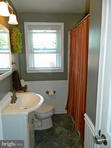 67 Garden Ridge Road Baltimore, MD 21228 - Photo 17 of 26 a bathroom with a sink and a mirror