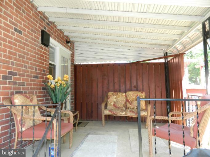 67 Garden Ridge Road Baltimore, MD 21228 - Photo 19 of 26 a backyard of a house with sofas