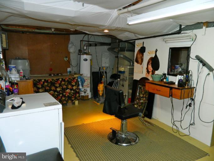 67 Garden Ridge Road Baltimore, MD 21228 - Photo 20 of 26 a view of a room with gym equipment