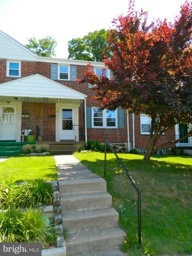 67 Garden Ridge Road Baltimore, MD 21228 - Photo 26 of 26 a front view of a house with garden