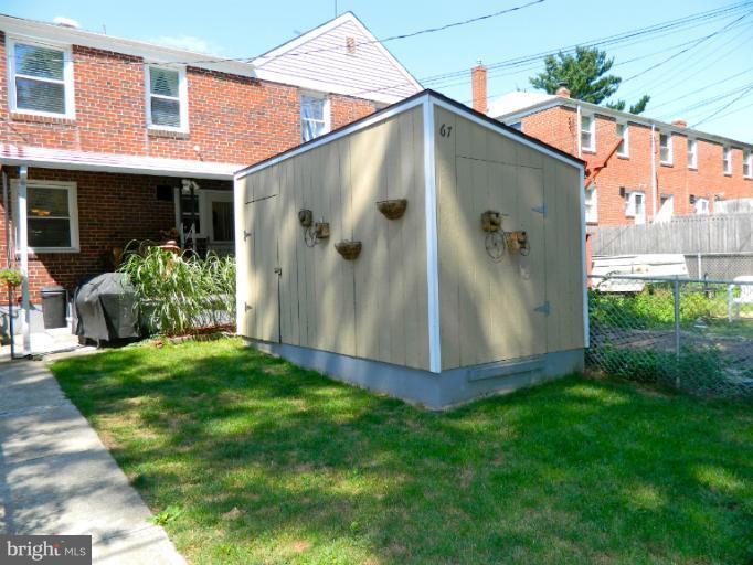 67 Garden Ridge Road Baltimore, MD 21228 - Photo 4 of 26 a view of a house with a yard and plants