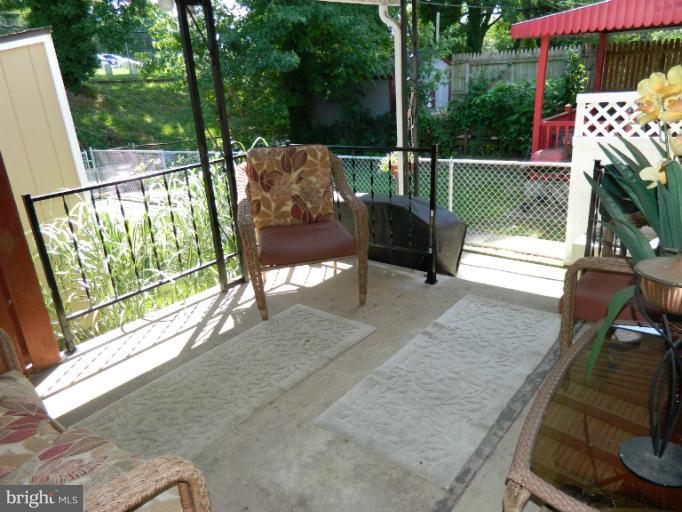 67 Garden Ridge Road Baltimore, MD 21228 - Photo 5 of 26 a view of a two chairs in the roof deck