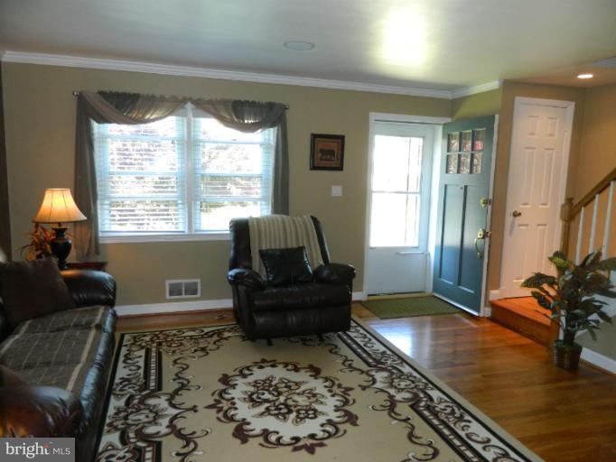 67 Garden Ridge Road Baltimore, MD 21228 - Photo 7 of 26 a living room with furniture and a large window