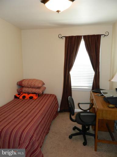 67 Garden Ridge Road Baltimore, MD 21228 - Photo 10 of 26 a bedroom with a bed and a window
