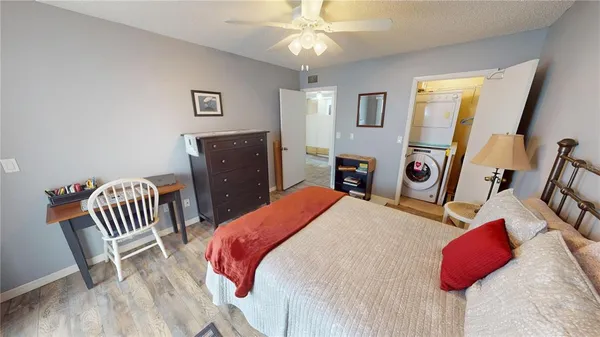 a bathroom with a sink vanity mirror and toilet