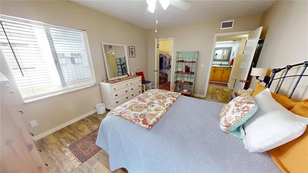 a bedroom with furniture and a window