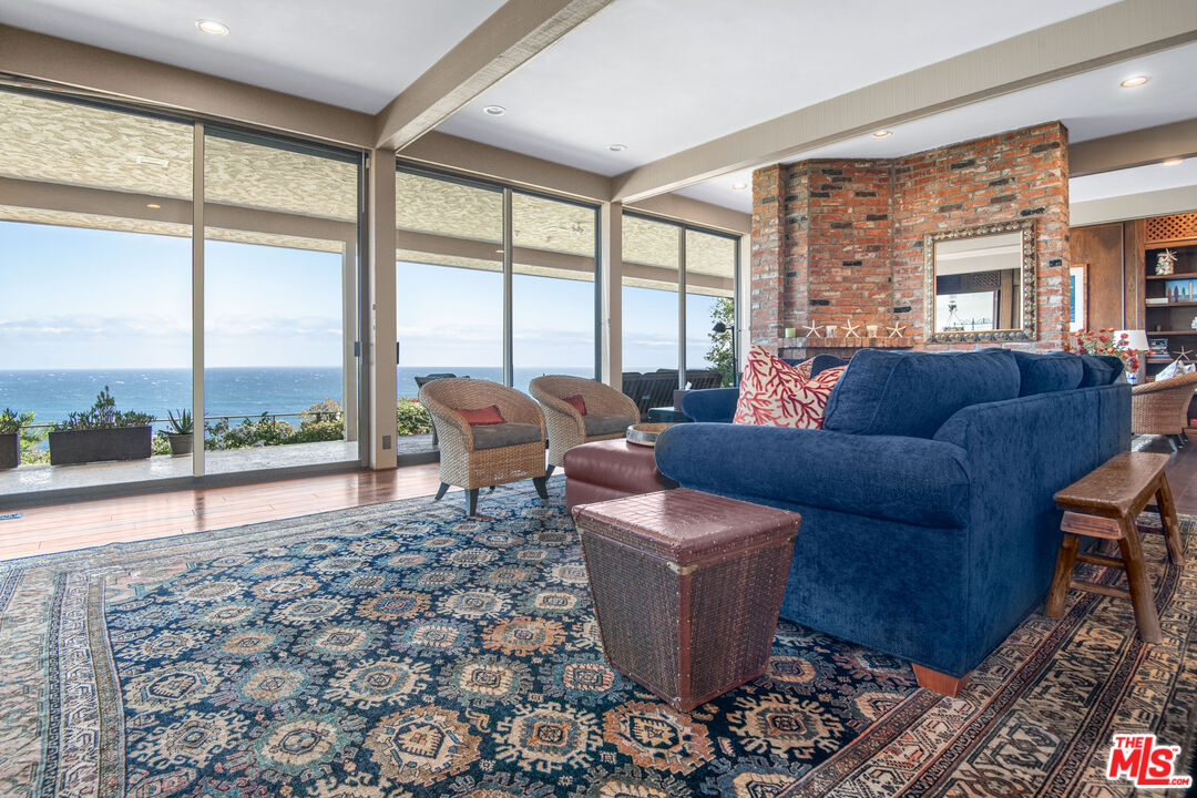 29008 Cliffside Drive Malibu, CA 90265 - Photo 13 of 28 a living room with furniture and a large window