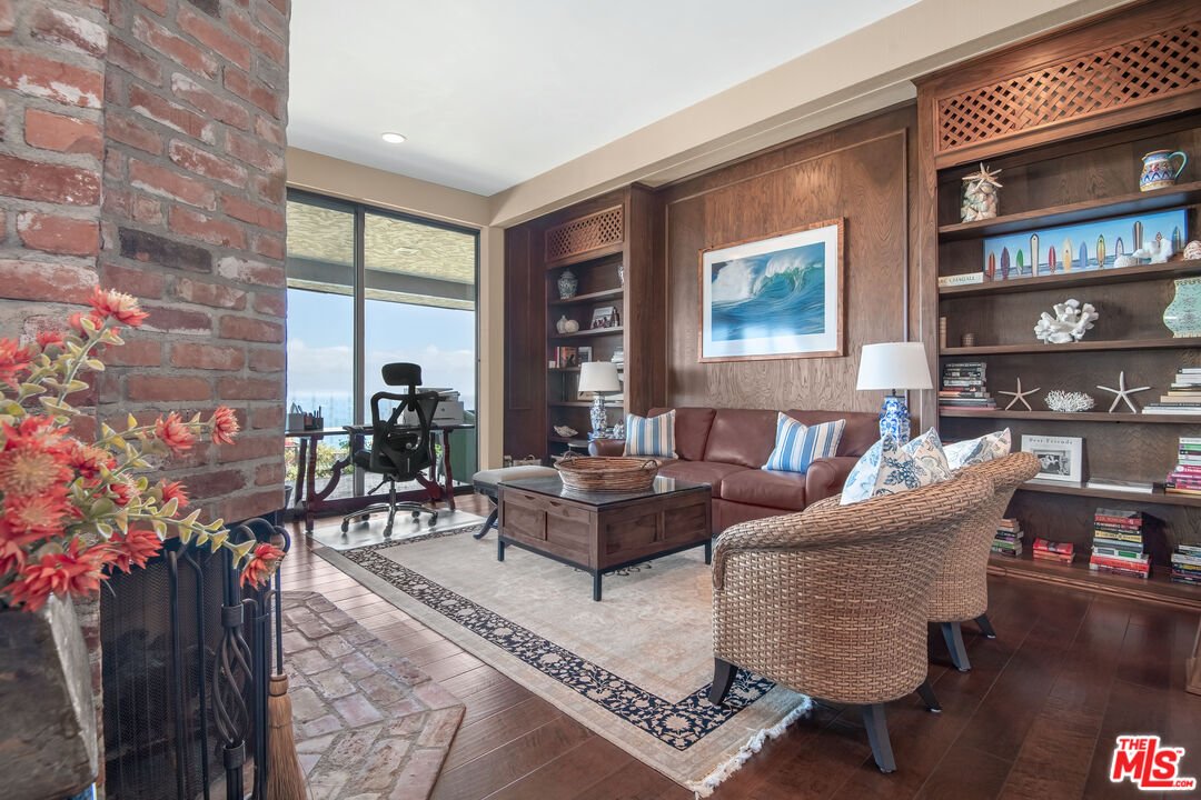 29008 Cliffside Drive Malibu, CA 90265 - Photo 17 of 28 a living room with furniture and a potted plant