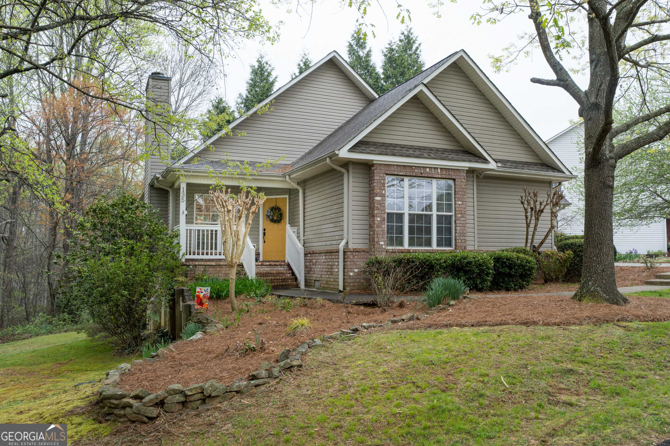 a front view of a house with garden