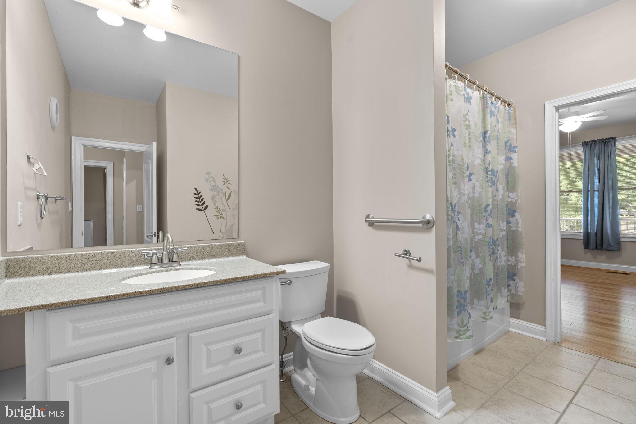 8024 Solley Road Glen Burnie, MD 21060 - Photo 46 of 83 a bathroom with a granite countertop sink toilet and shower