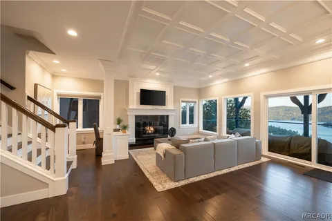 a living room with furniture fireplace and flat screen tv