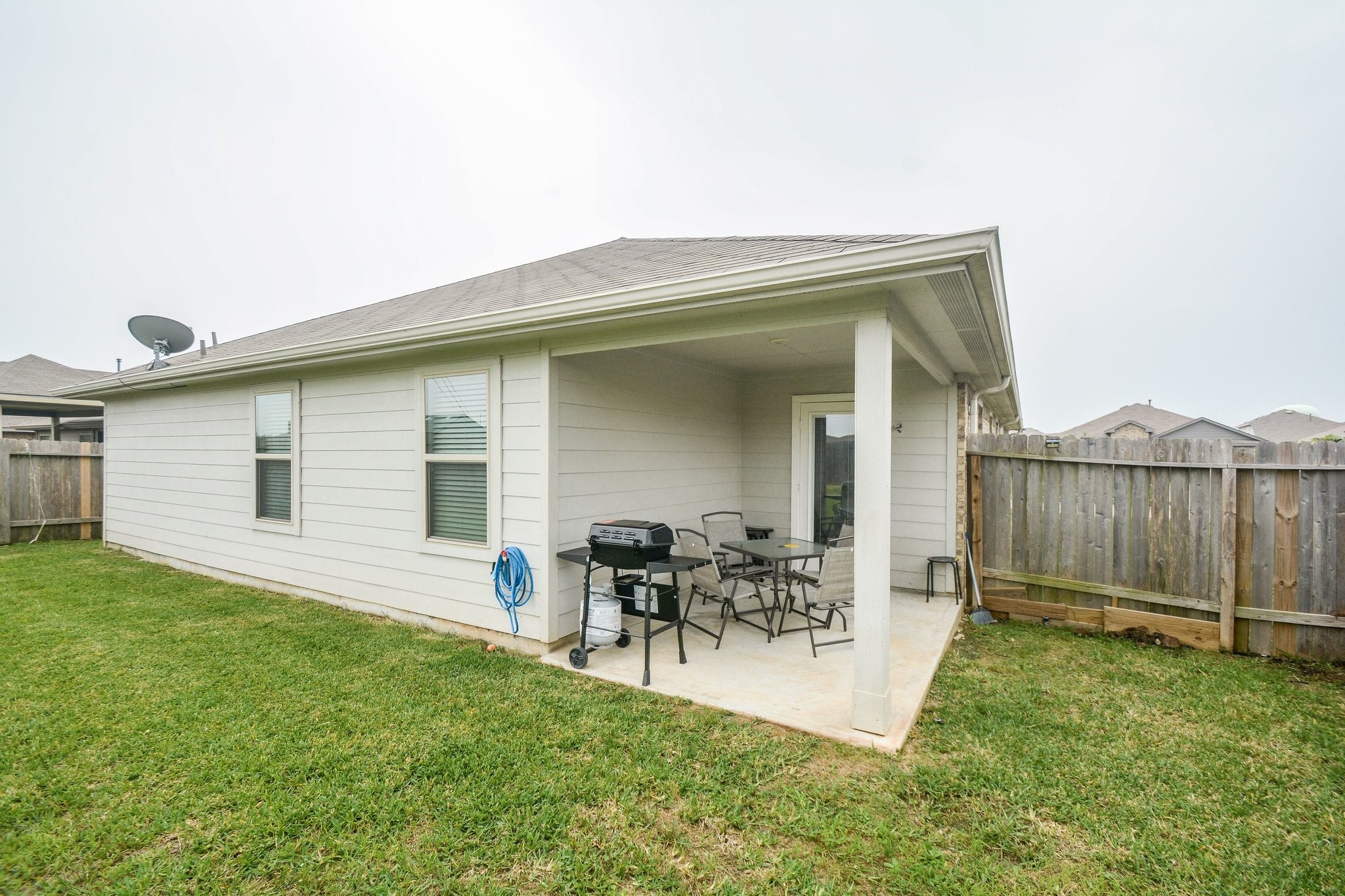 23510 Harrow Fld Lane Spring, TX 77373 - Photo 16 of 18 a backyard of a house with table and chairs