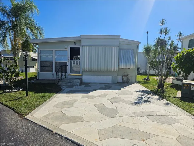 a view of backyard with a garden and seating space