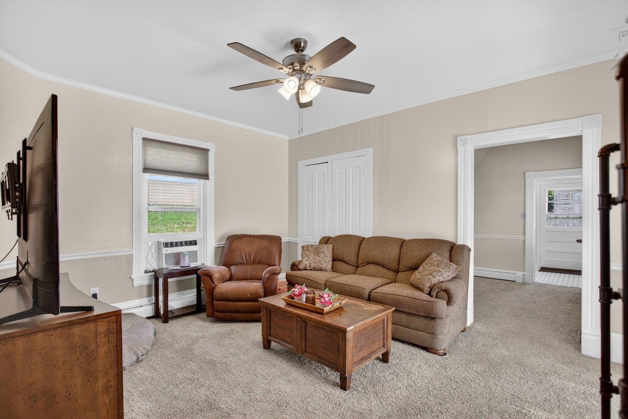 420 West Spring Street Woodstock, VA 22664 - Photo 11 of 67 a living room with furniture and a flat screen tv