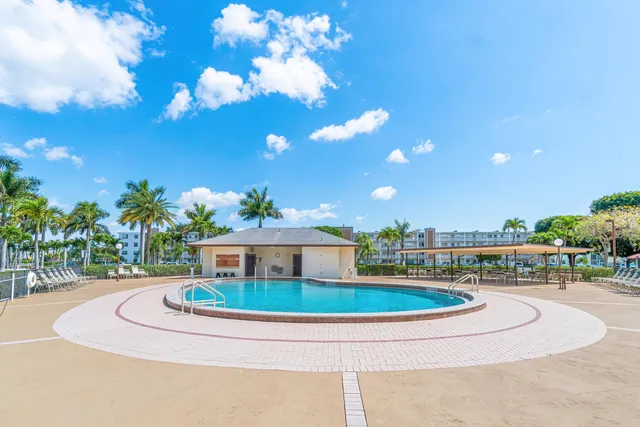 a view of a house with a yard porch and sitting area