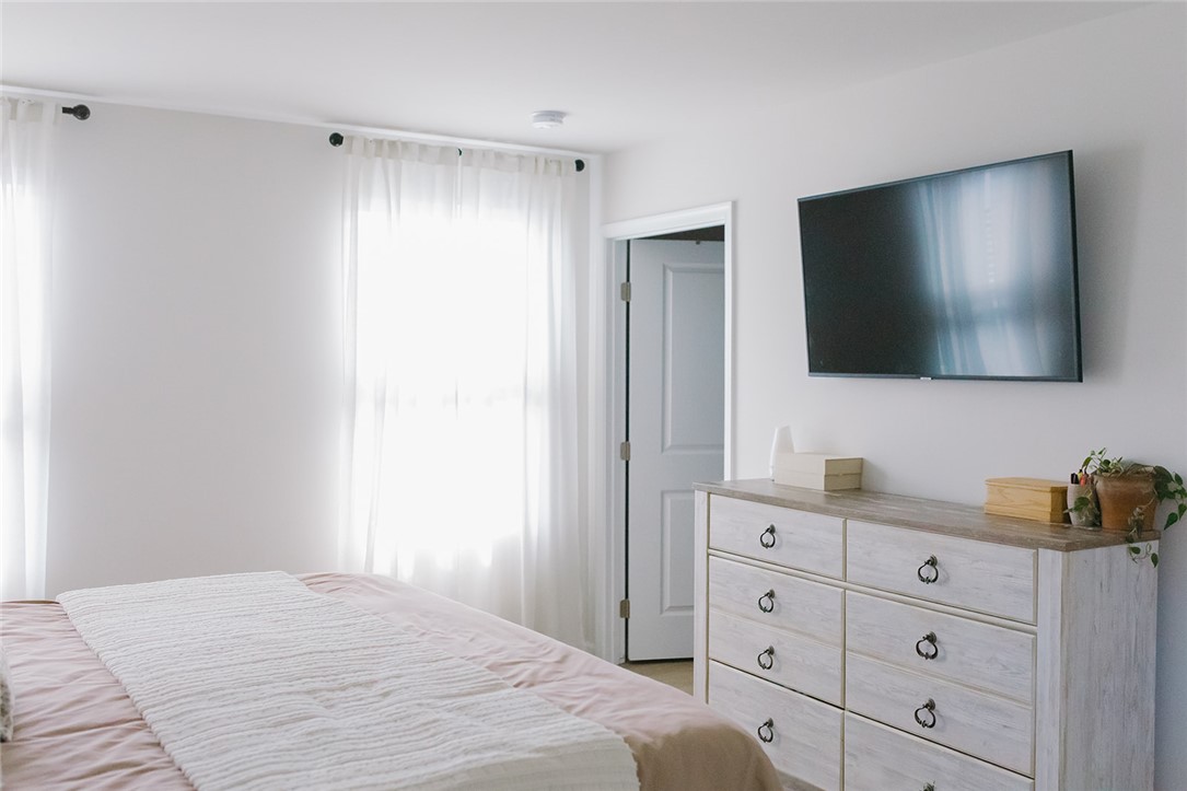 314 Callie Way Easley, SC 29642 - Photo 10 of 27 This serene bedroom offers abundant natural light and ample space for personal retreat.