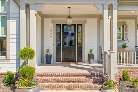 a view of a a dining room with furniture window and wooden floor