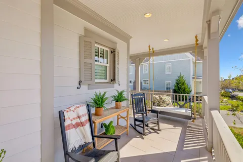 a living room with furniture a bookshelf and a fireplace