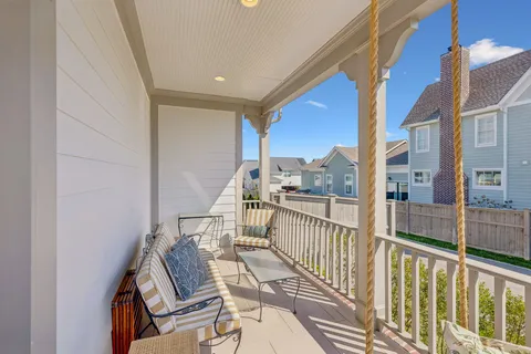 a living room with furniture a rug and a fireplace