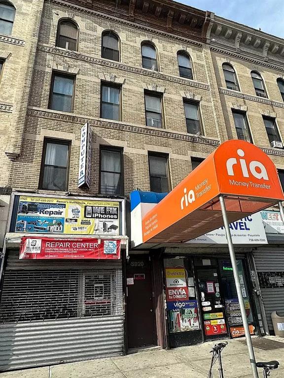 a view of a cafe with retail shops
