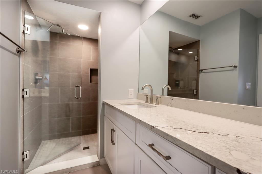 2585 Old Groves Road, Unit L203 Naples, FL 34109 - Photo 12 of 21 Bathroom with vanity, a shower stall, and recessed lighting