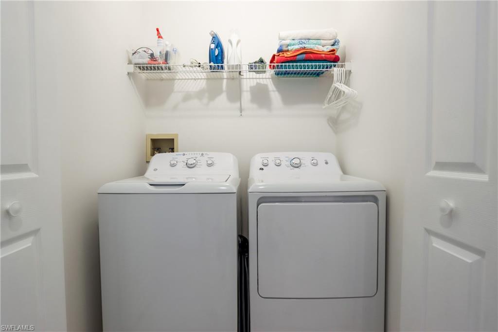 2585 Old Groves Road, Unit L203 Naples, FL 34109 - Photo 16 of 21 Laundry room featuring independent washer and dryer