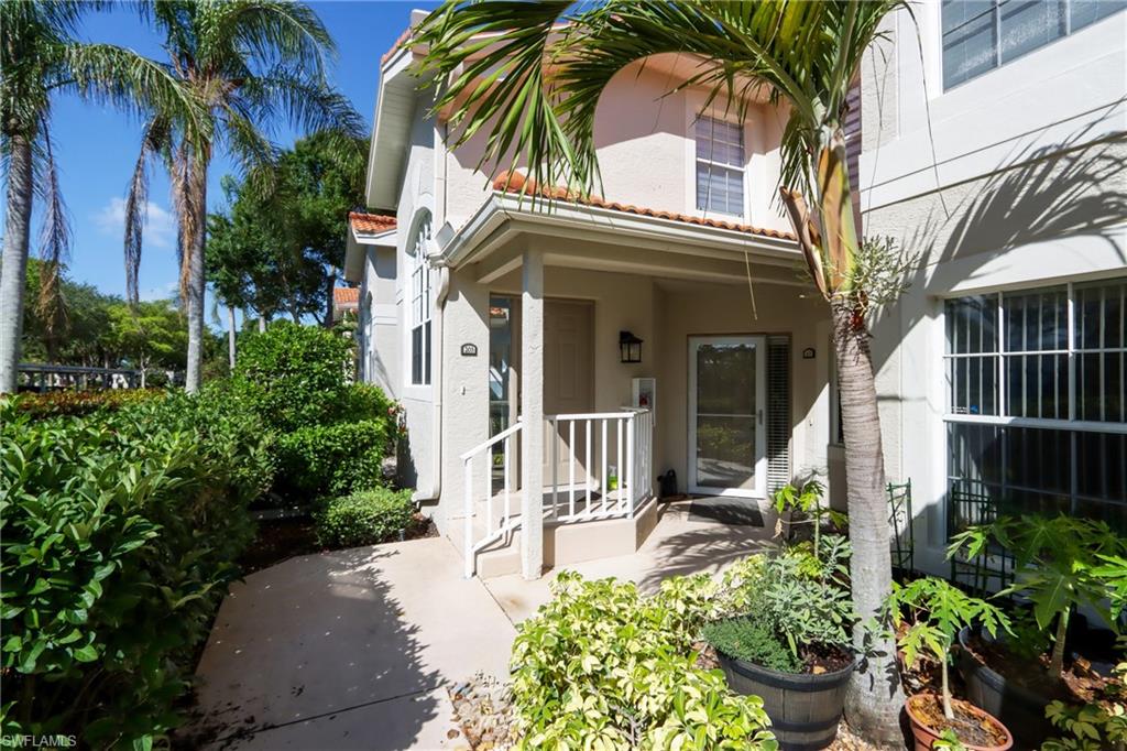 2585 Old Groves Road, Unit L203 Naples, FL 34109 - Photo 17 of 21 View of exterior entry with stucco siding
