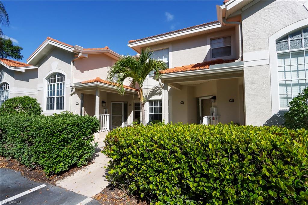 2585 Old Groves Road, Unit L203 Naples, FL 34109 - Photo 18 of 21 View of exterior entry with stucco siding
