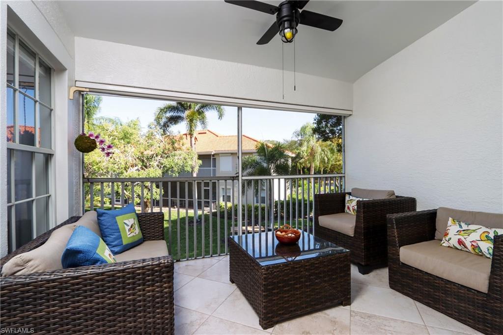 2585 Old Groves Road, Unit L203 Naples, FL 34109 - Photo 2 of 21 Sunroom with a ceiling fan, outdoor lounge area, and vaulted ceiling