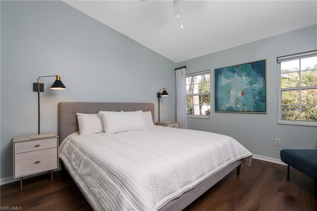 2585 Old Groves Road, Unit L203 Naples, FL 34109 - Photo 9 of 21 Bedroom with wood finished floors, lofted ceiling, and a ceiling fan