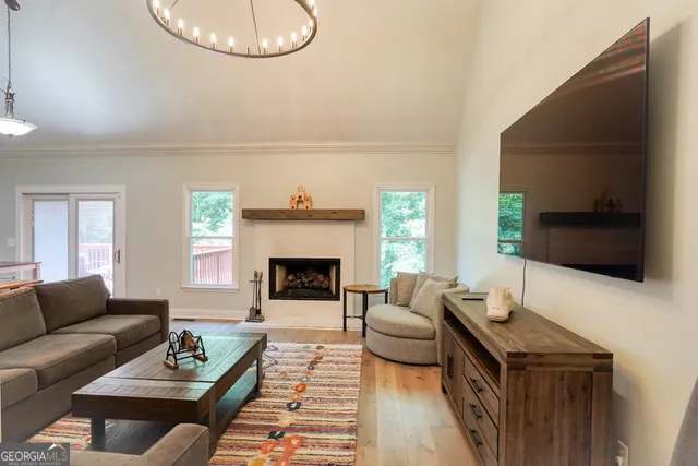 a living room with furniture and a flat screen tv