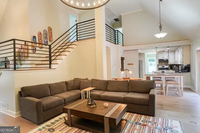 a living room with furniture a ceiling fan and a rug