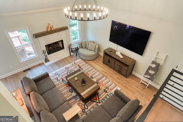 335 Butterfield Lane Fayetteville, GA 30214 - Photo 17 of 27 a living room with furniture a fireplace and a flat screen tv