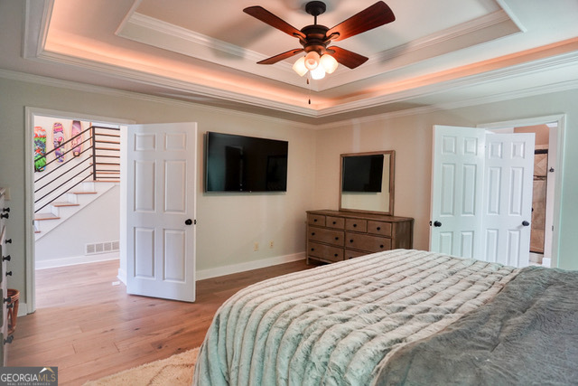 335 Butterfield Lane Fayetteville, GA 30214 - Photo 22 of 27 a bedroom with a bed and a flat screen tv