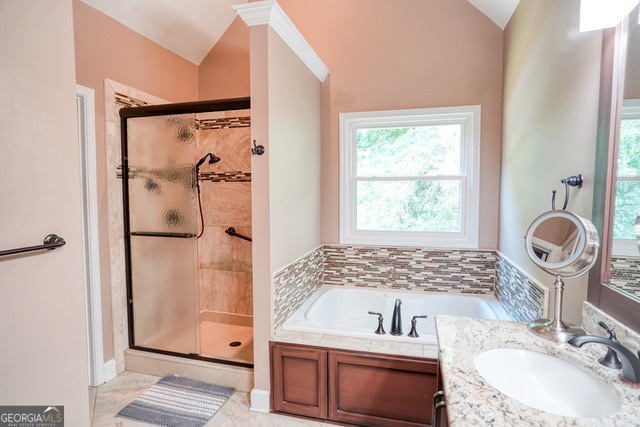 335 Butterfield Lane Fayetteville, GA 30214 - Photo 24 of 27 a bathroom with a sink a toilet and shower