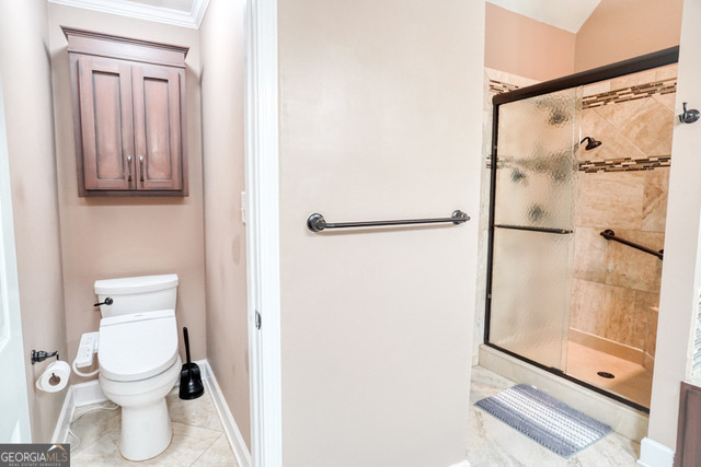 335 Butterfield Lane Fayetteville, GA 30214 - Photo 25 of 27 a white toilet sitting next to a bathroom sink
